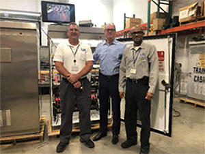 Pictured (left to right): Traffic Signals Supervisor Chris Brandes, Commissioner Fisher, Traffic Operations Superintendent Alex Vickers