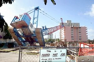 Crane toppled onto the Maracay Condominium