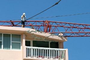 Crane Lodged Above Rick & Adele Peterson's Corner Balcony