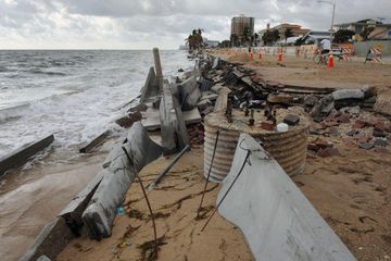 Concrete wall barriers as breakwaters piled along A1A