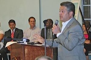 Representative George Moraitis listens to Chip LaMarca discuss A1A Recovery plans at Beach Community Center