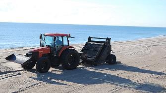 Beach Raker Cleans Beach