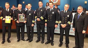 Fire Chief Robert Hoecherl, Captain Greg May, Deputy Fire Chiefs Doug Stanley and Tim Heiser, Fire Marshal Jeff Lucas, Deputy Fire Chief Bob Simac and City Manager Lee Feldman