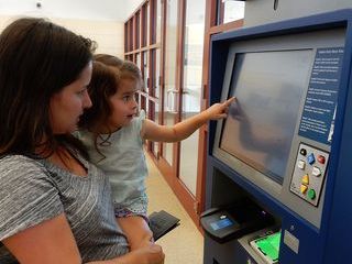 Passenger Using New Global Entry Kiosk at FXE