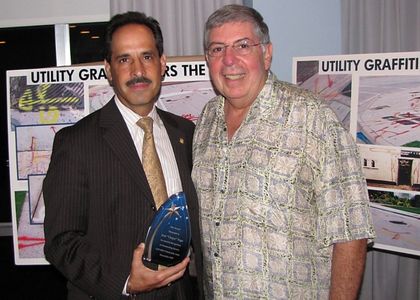 Beach Foreman Mark Almy, GMCA President Pio Ieraci presents award to Jos Chepo Vega for contributions to neighborhood