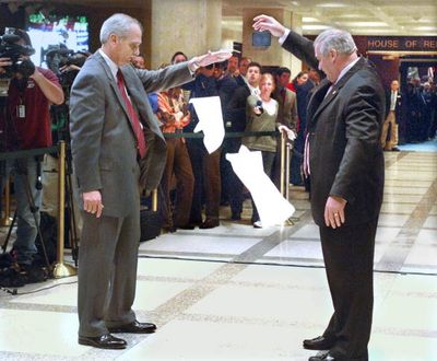 House Sergeant-at-arms Earnie Sumner and Senate Sergeant-at-arms Donald Severance drop handkerchiefs at the stroke of midnight, marking the 'sine die' adjournment of the 2012 legislative session