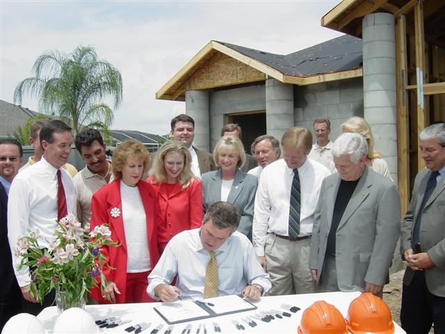 Senator Atwater Watches Gov Bush Enact His Bill