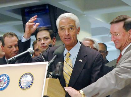 Governor Charlie Crist gestures after sine die before Policy & Budget Chairman Ray Sansom, Speaker Marco Rubio and Senate President Kenneth Pruitt