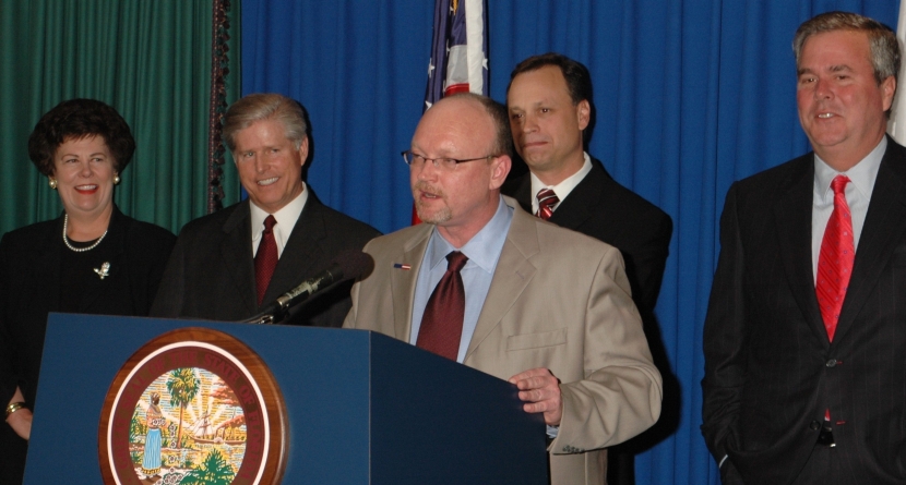 Commissioner Kevin M. McCarty of the Office of Insurance Regulation and Governor Jeb Bush at SB 1980 Bill Signing