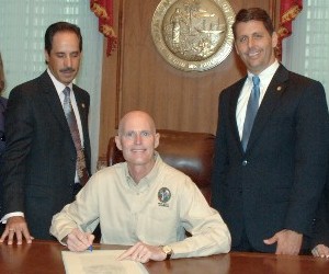 Presidents Council Chair Pio Ieraci and Representative George Moraitis as Governor Rick Scott Signs House Bill 1195