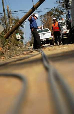 Out Of State Electrical Workers Fix Rotted Pole